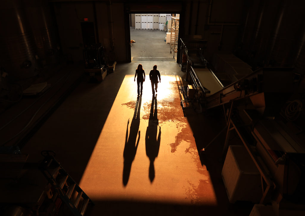Winemaker Nicole Hitchcock, left and J Vineyards and Winery production manager Raquel Barajas walk to see if a load of freshly picked grapes has arrived for sorting, Friday Sept. 1, 2017. (Kent Porter / The Press Democrat) 2017