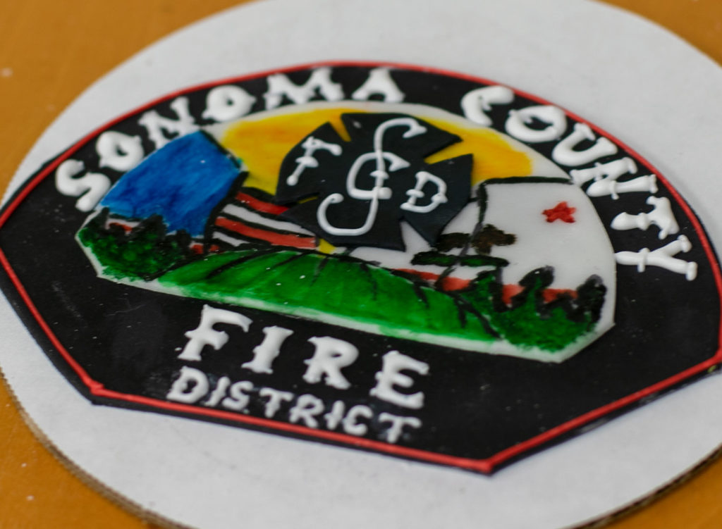 Details of a Kincade Fire first responders' cake created by Costeaux Bakery's Karah Williams, Nerissa Sutton, Silva Nunez and Dioselena Madrano in Healdsburg. Heather Irwin/PD
