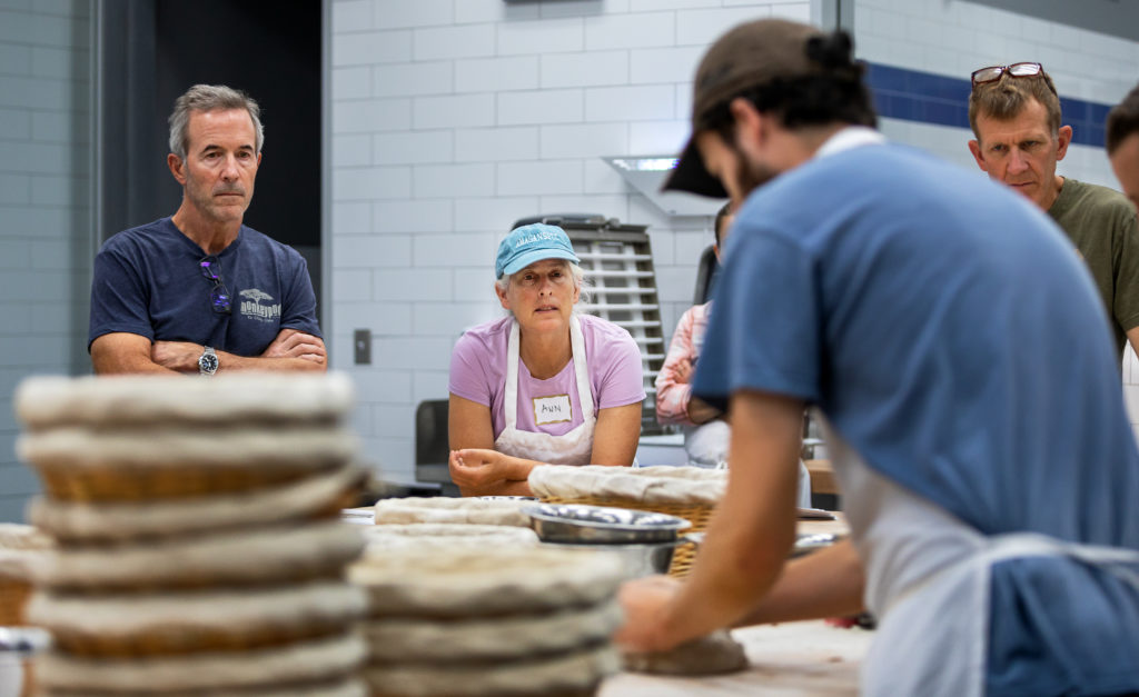 Students practice their baking skills at the Artisan Baking Center in Petaluma. (Chris Hardy) Paul Kunkel and Ann Sydeman watching other people's folding techniques