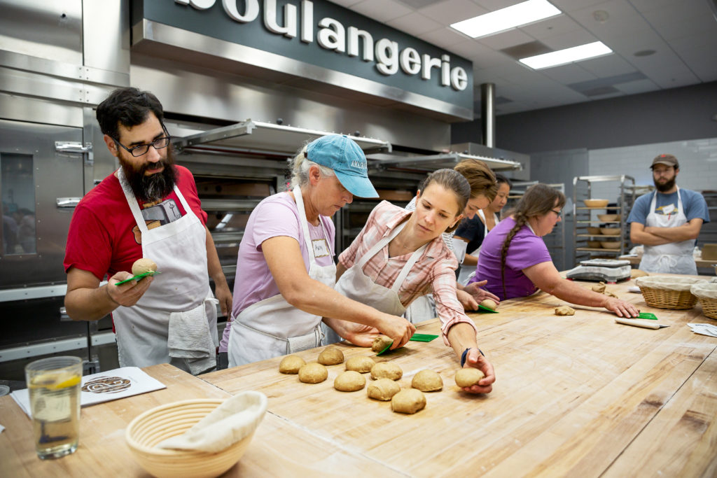 Students Ann Sudeman and Charlotte Rutledge make ciabatta hamburger buns. (Chris Hardy)