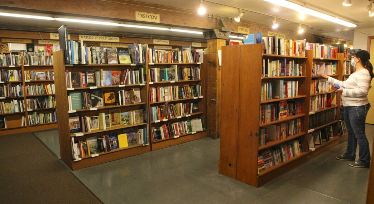 Rita Schaefer browses the used books at Copperfield's in downtown Petaluma on June 6, 2020. The store allowed a few shoppers at a time to come in. Until recently, they conducted retail sales via curbside pickup. Most customers were thrilled to walk the aisles and look at and touch books in person. (Crissy Pascual / Petaluma Argus-Courier)