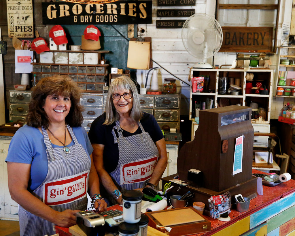 Proprietors Elisa Burroughs, left, and her mother Linda Elgin pose for a portrait behind the cash register at Gin'gilli's Vintage Home in Geyserville, California, on Tuesday, July 30, 2019. (Alvin Jornada / The Press Democrat)