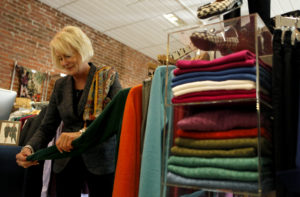 10/28/2012: T2: PC: Susan Graf straightens up merchandise in her shop Susan Graf Limited in Healdsburg, California on Tuesday, October 23, 2012. (BETH SCHLANKER/ The Press Democrat)