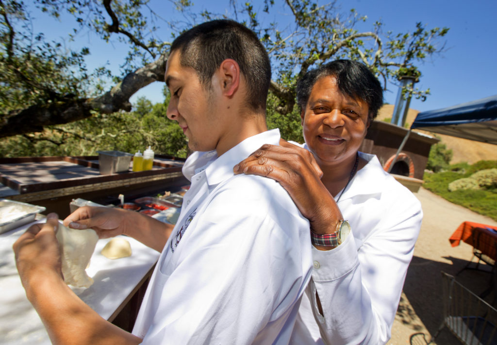 Worth Our Weight Executive Director Evelyn Cheatham and one of her star graduates, Robb Ledesma at the "Pizza in Paradise" lunch at Paradise Ridge Winery in Santa Rosa. (John Burgess/The Press Democrat)