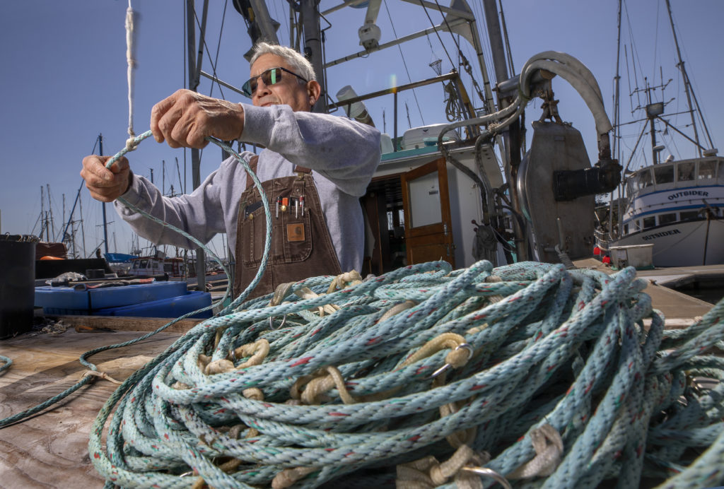 Dick Ogg untangles gear after a day of black cod fishing aboard the Karen Jeanne at the Spud Point Marina in Bodega Bay. (John Burgess)