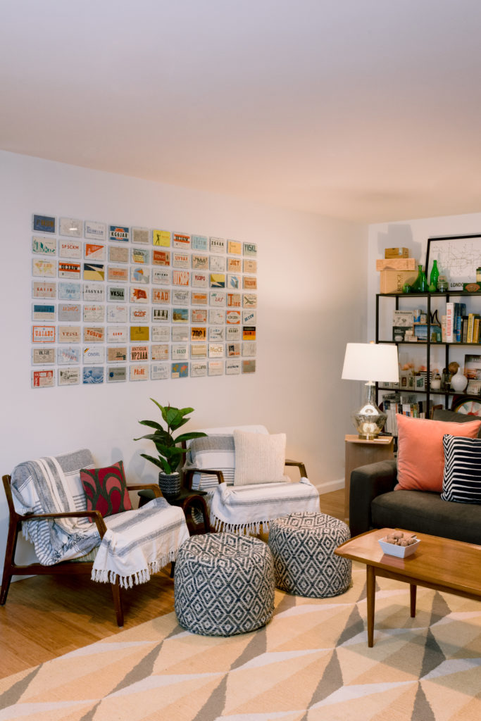 Family room displaying vintage call cards and shelf in background with collected trinkets.