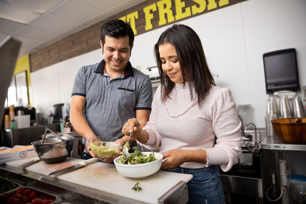 Adrian and Susan Olvera prepare El Huerto's Shredded Vegetable Salad with Avocado-Lime Dressing. (Chris Hardy)