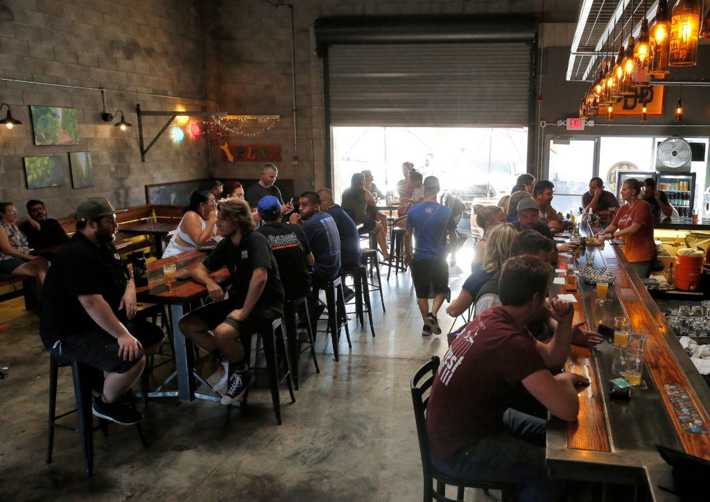 Customers enjoy the selection of brews and food at Barley and Bine Beer Cafe in the Town of Windsor beverage district along Bell Road, in Windsor, California, on Saturday, August 31, 2019. (Alvin Jornada / The Press Democrat)