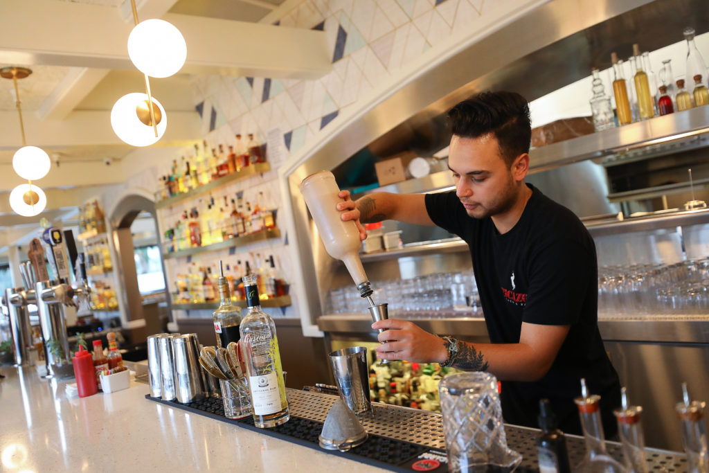 Cristofer Goodman mixes a drink at Picazo Kitchen & Bar, in Sonoma on Wednesday, December 11, 2019. (Christopher Chung/ The Press Democrat)