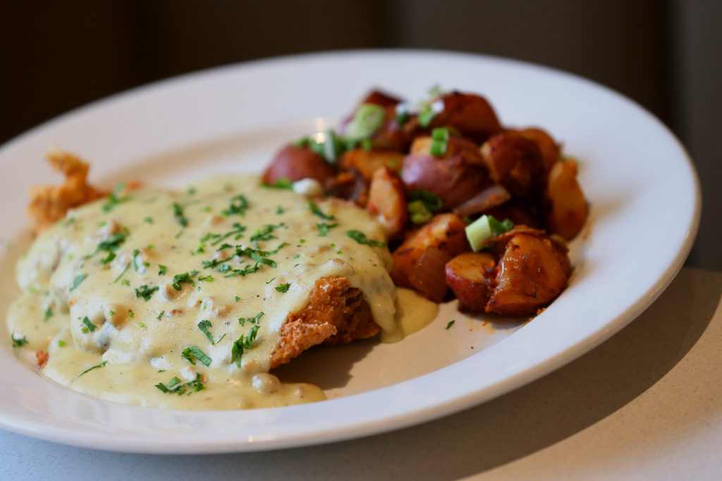 Chicken Fried Chicken at Picazo Kitchen & Bar, features buttermilk fried Mary's chicken breast, served with homemade salsa verde sausage gravy, and breakfast potatoes. (Christopher Chung/ The Press Democrat)