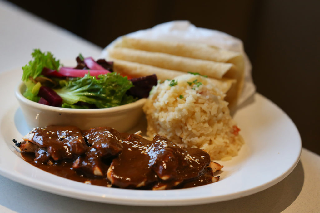 Maria's Mole, at Picazo Kitchen & Bar, features mole rojo, chicken breast, rice, and baby salad. (Christopher Chung/ The Press Democrat)