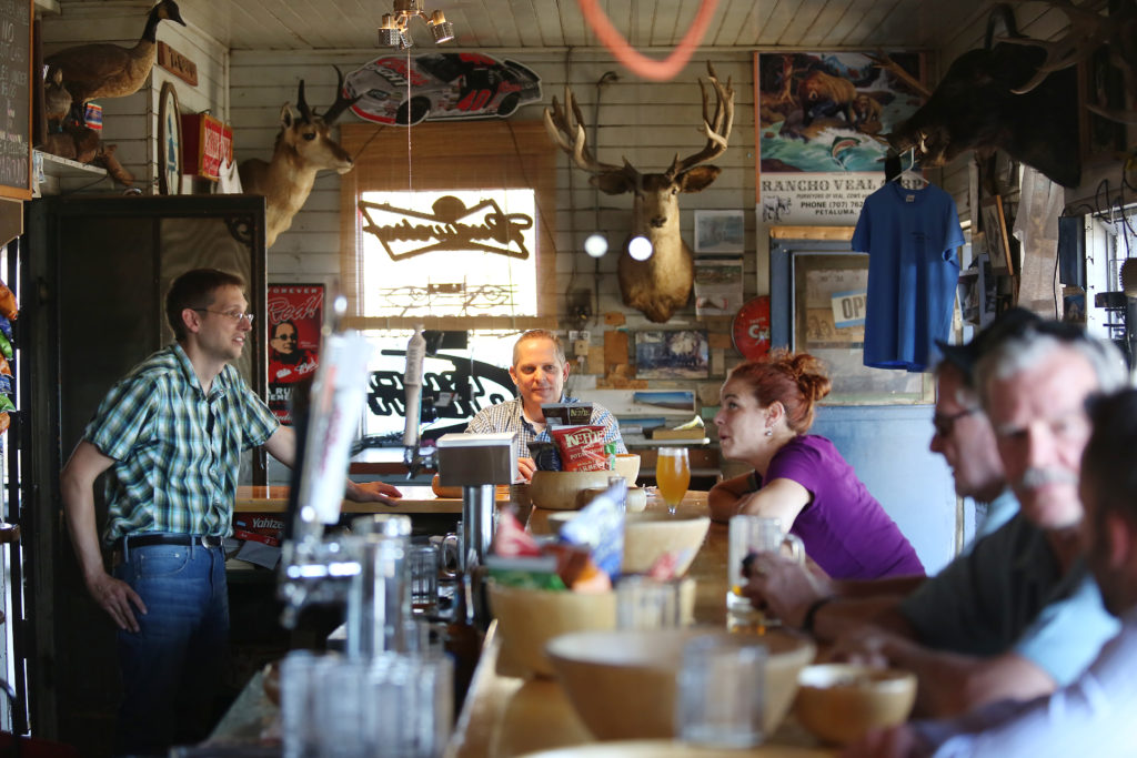 Bartender and owner Ernie Altenreuther, left, talks with regulars at Ernie's Tin Bar in Petaluma on Wednesday, July 31, 2013. (Conner Jay)