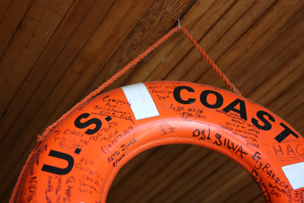 A U.S. Coast Guard lifebuoy with personal messages about Ernie's Tin Bar hangs from the roof of the bar in Petaluma on Wednesday, July 31, 2013. (Conner Jay)