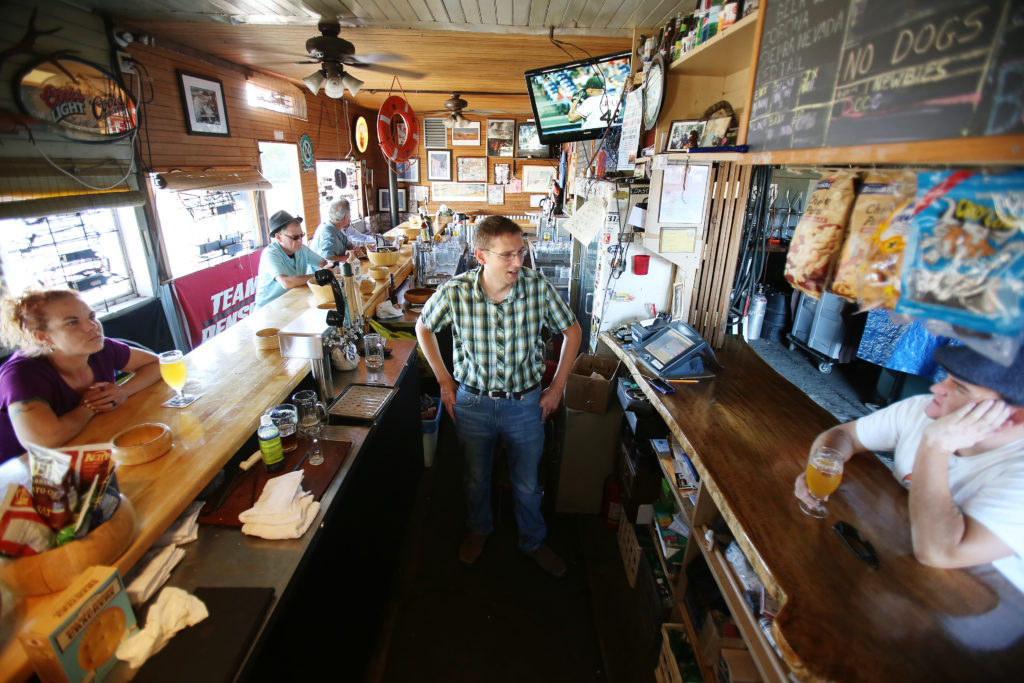 Bartender and owner Ernie Altenreuther, center, talks with regulars at Ernie's Tin Bar in Petaluma on Wednesday, July 31, 2013. (Conner Jay)