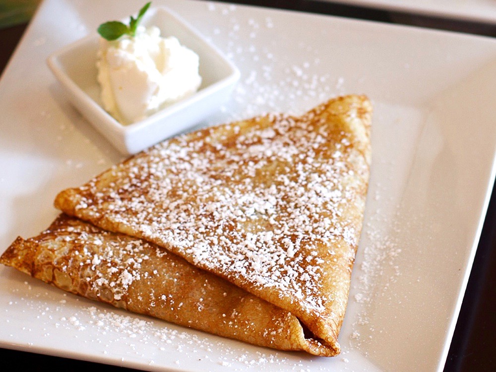Peche Melba crepe with preserved peach, berry jam, toasted almonds, chantilly cream with hard cider at Creperie Chez Solange in Larkfield. Heather Irwin/PD.