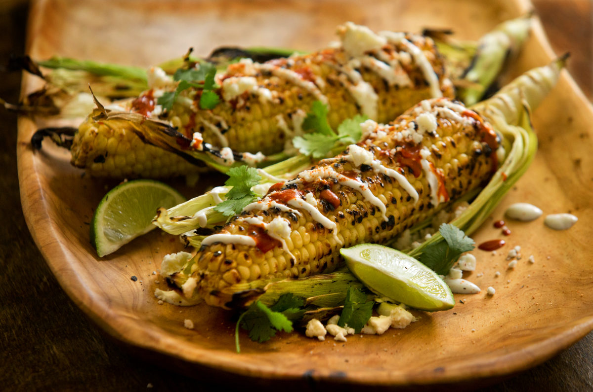 Grilled Mexican-style corn-on-the-cob with Cuban cream, cotija cheese and hot sauce from Rocker Oysterfeller's Kitchen + Saloon in Valley Ford. (John Burgess/The Press Democrat)