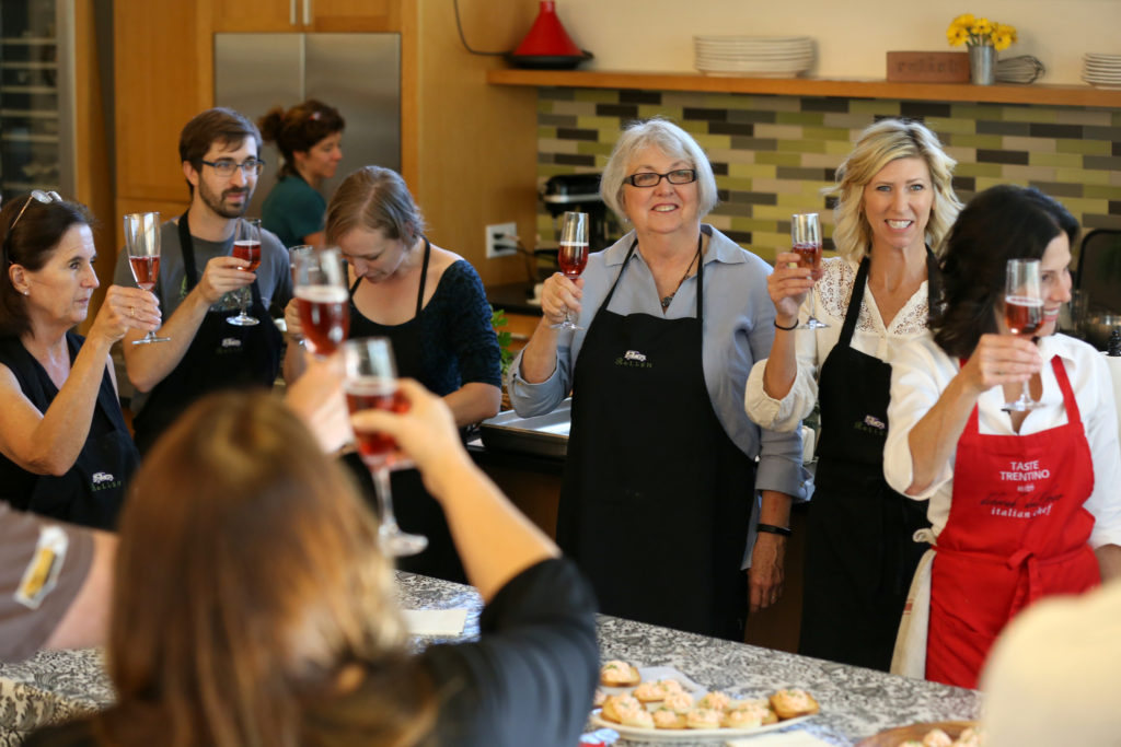 Participants of a "Holiday Entertaining, Northern Italian Style" cooking class raise their glasses in a toast at Relish Culinary Adventures in Healdsburg on Sunday, October 20, 2019. (BETH SCHLANKER/ The Press Democrat)