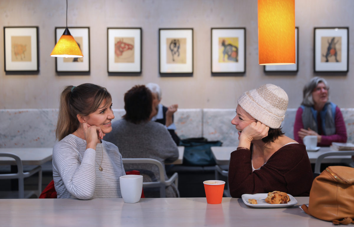Maureen Vaillancourt, left, and Laura Carr talk at the new Cafe Frida Gallery, in the South of A Street arts district of Santa Rosa on Friday, January 24, 2020. (Christopher Chung/ The Press Democrat)