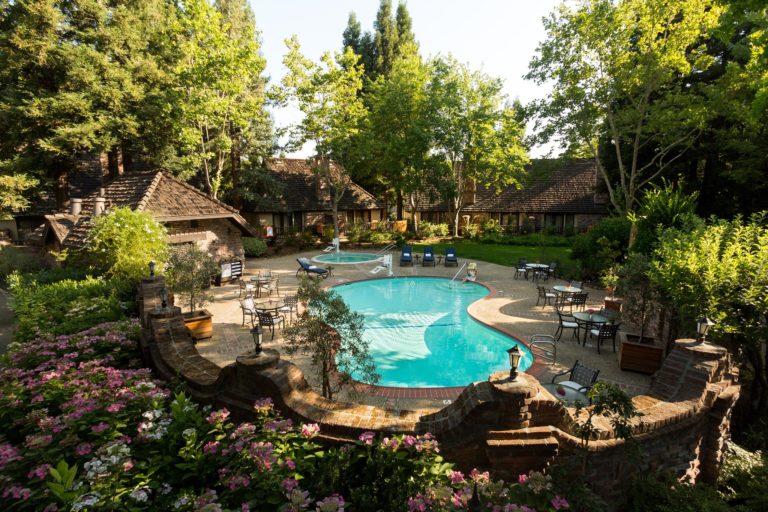 Although it’s located right off of Highway 29 in St. Helena, Harvest Inn feels like you’ve discovered a secret stretch of Napa Valley. The grounds are lush, peaceful and covered with towering redwoods. (Courtesy of Harvest Inn)