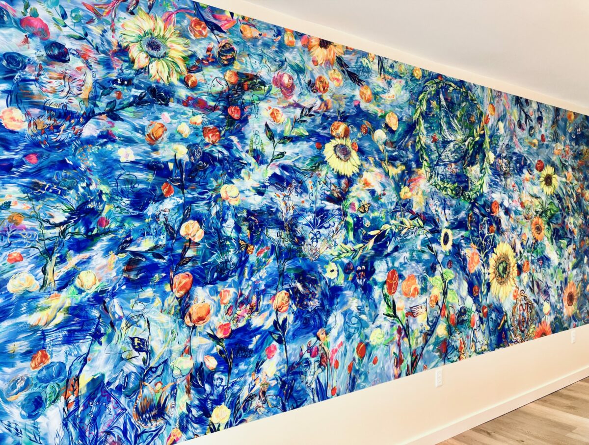 Maria de Los Angeles' mural “Raising Rainbows,” measuring 7 feet by 17 feet, is on view in the Santa Rosa Junior College foundation building’s community room. (Ryan Bonilla)