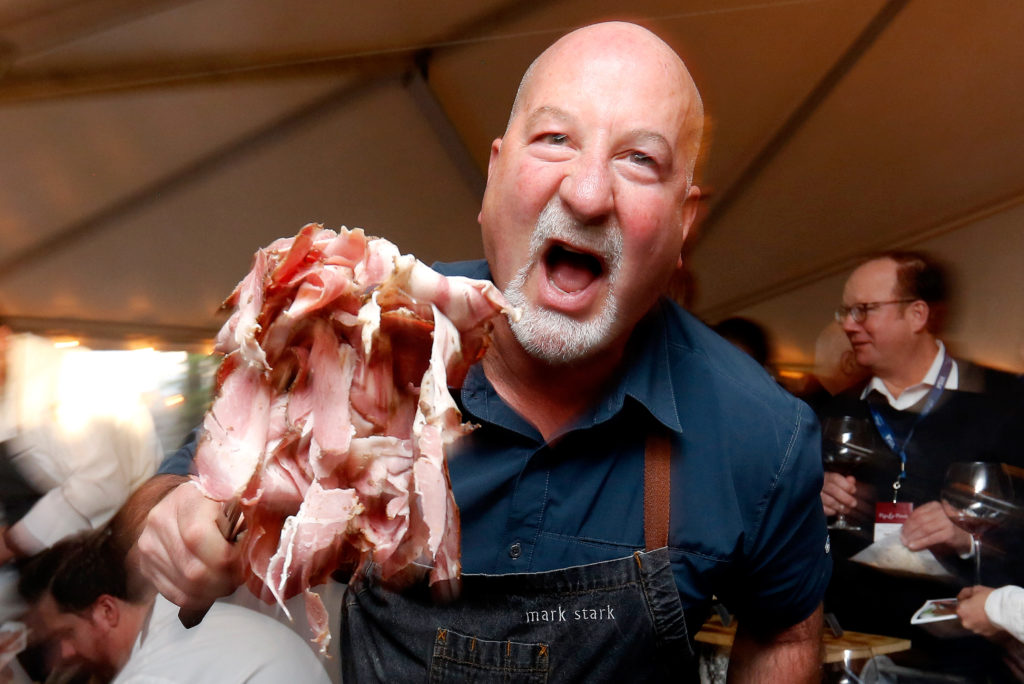 Chef Mark Stark grills up pastrami pork and everything spice steam buns during Pigs and Pinot at Hotel Healdsburg, in Healdsburg, California, on Friday, March 16, 2018. (Alvin Jornada)