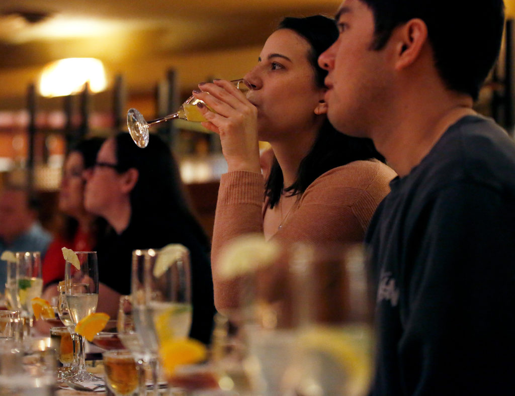 Chelsea Bruno of San Rafael tastes a sip of a lemon basil drop cocktail during a seminar about pairing cocktails and aromatic bitters with cheese, at the 13th annual California Artisan Cheese Festival at the Flamingo Resort and Conference Center in Santa Rosa, California, on Saturday, March 23, 2019. (Alvin Jornada / The Press Democrat)
