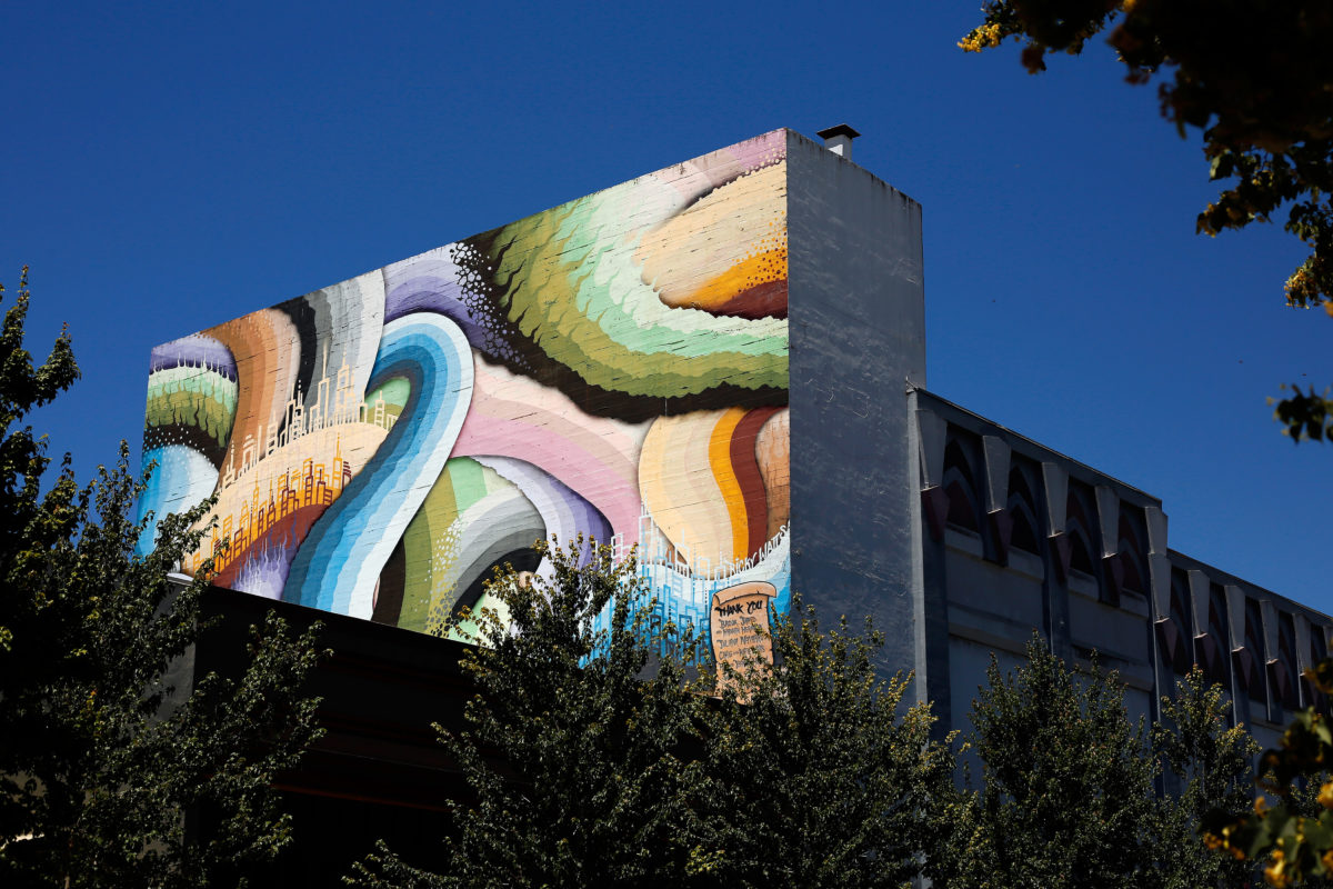 The colorful mural on the south wall of The Phoenix Theatre created by local Sonoma County artist Ricky Watts, in Petaluma on Thursday, July 5, 2018. (Alvin Jornada / The Press Democrat)