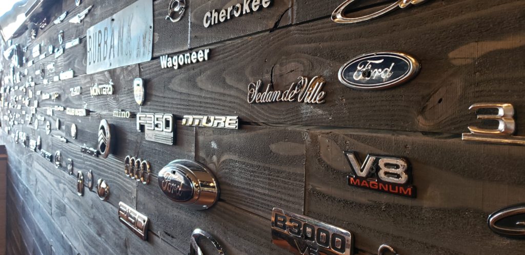 Car badges line the wall at Simmer Claw Bar in Rohnert Park. Heather Irwin/PD