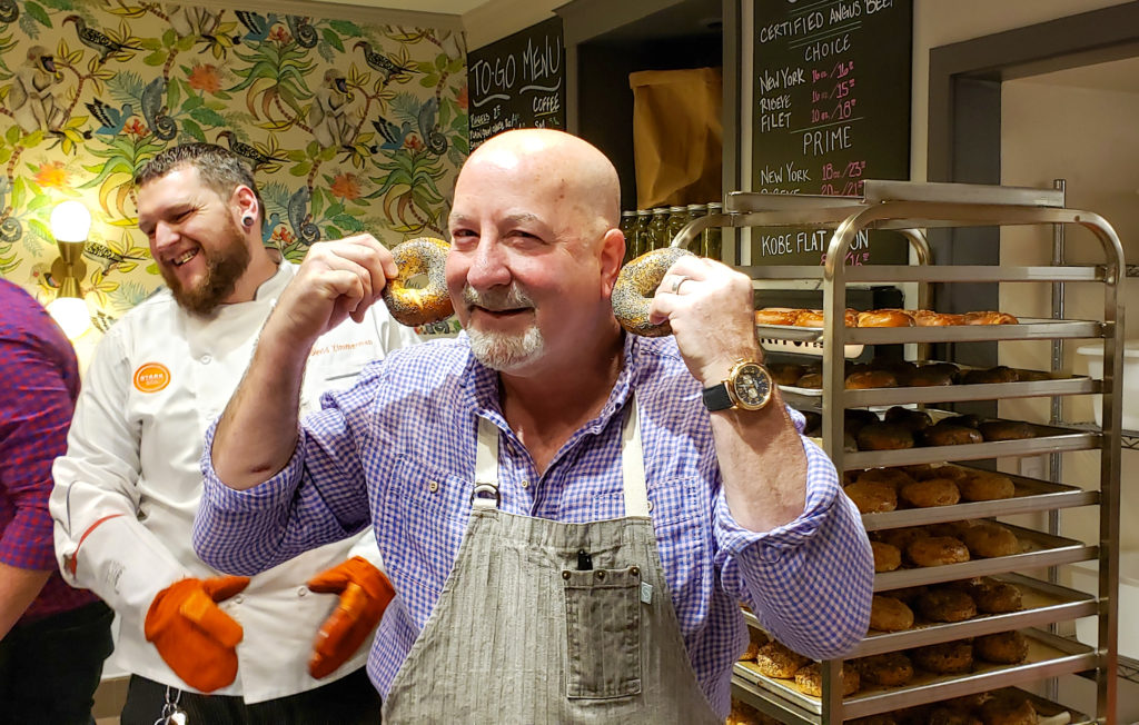 Mark Stark joking around with fresh bagels at Grossman's Noshery & Bar in Santa Rosa. Heather Irwin/PD