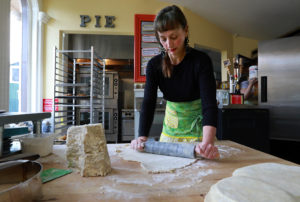 Trish Davis doesn't rely on machines when making her crusts. Each morning she rolls out the dough by hand at The Whole Pie in Santa Rosa. (John Burgess/The Press Democrat)