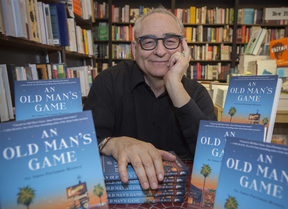 Andy Weinberger, proprietor of Readers' Books on East Napa Street in Sonoma, with his newly published book "An Old Man's Game." (Robbi Pengelly/Index-Tribune)