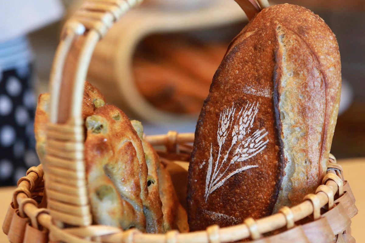 Rye flour and a stencil creates a beautiful pattern on breads at Goguette Bread in Santa Rosa. (John Burgess/The Press Democrat)