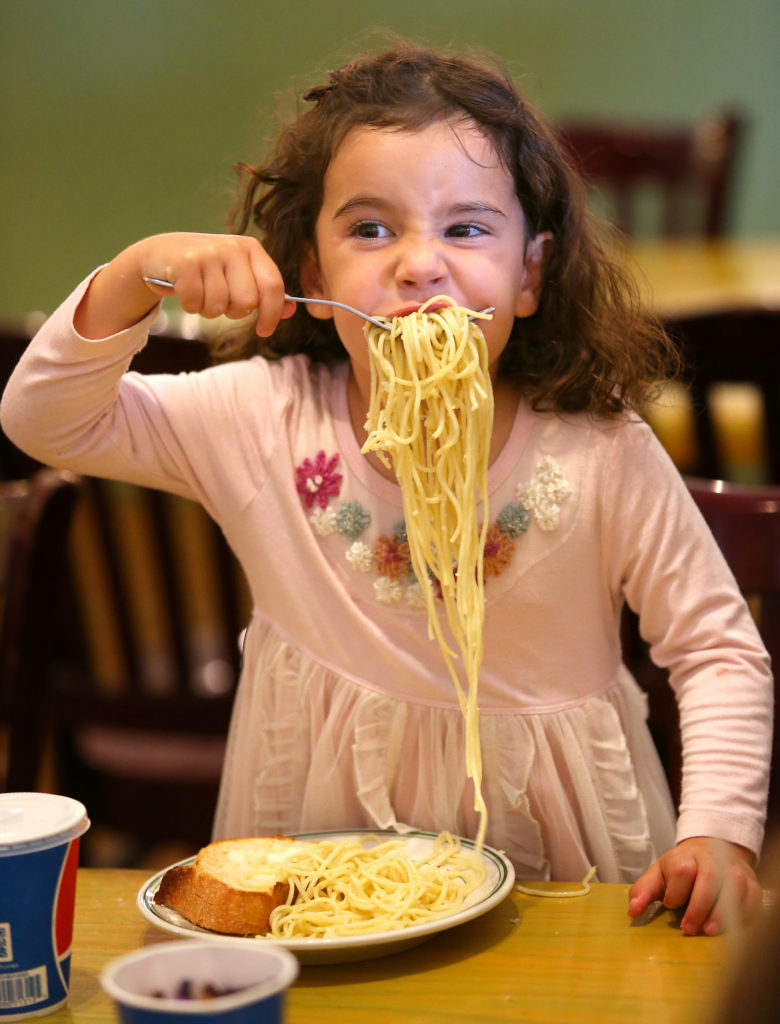 Sienna McAtee, 2, enjoys a plate of spaghetti at Mary's Pizza Shack, in Santa Rosa, on Tuesday, August 19, 2014. Mary's Pizza Shack was voted to have the best kids' menu. (Christopher Chung/ The Press Democrat)