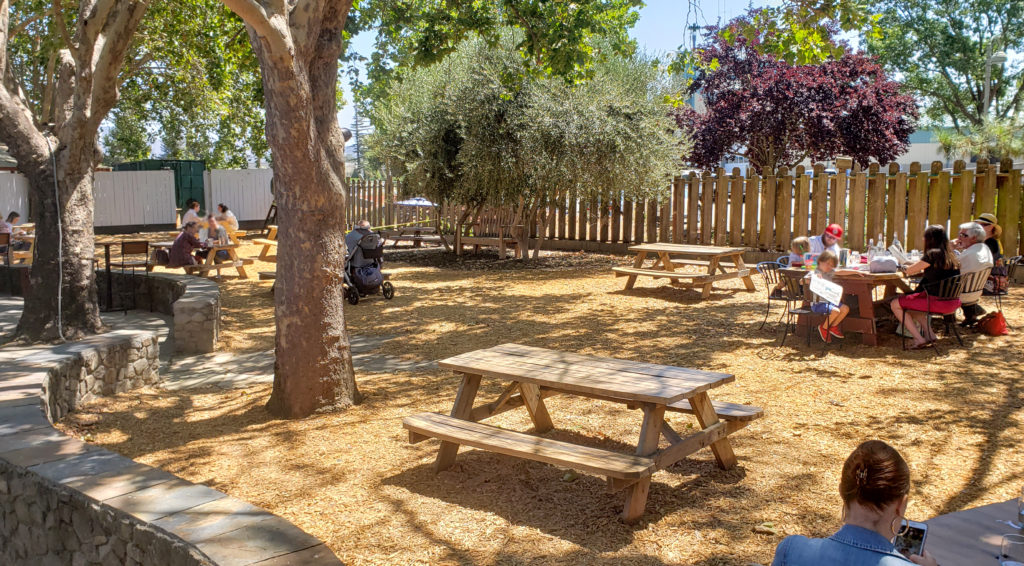 The breezy, shaded patio at Kivelstadt Cellars in Sonoma allows for social distanced dining. Heather Irwin / The Press Democrat