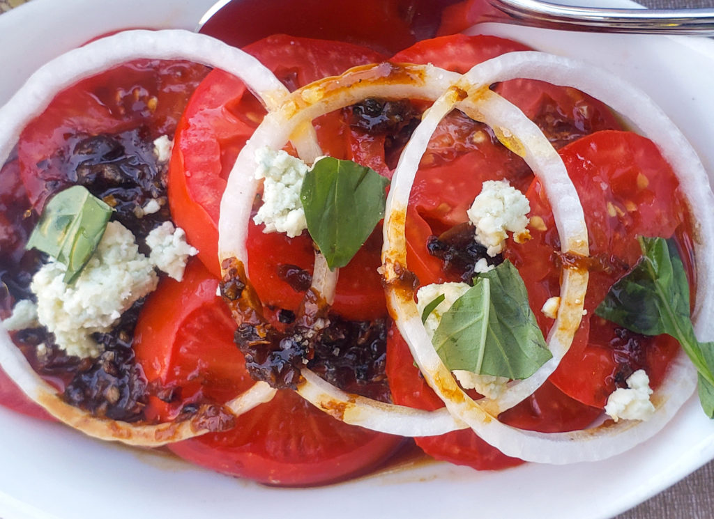 Early Girl tomatoes with sweet onions at Stark's Steak and Seafood's Brazilian popup. Heather Irwin/PD