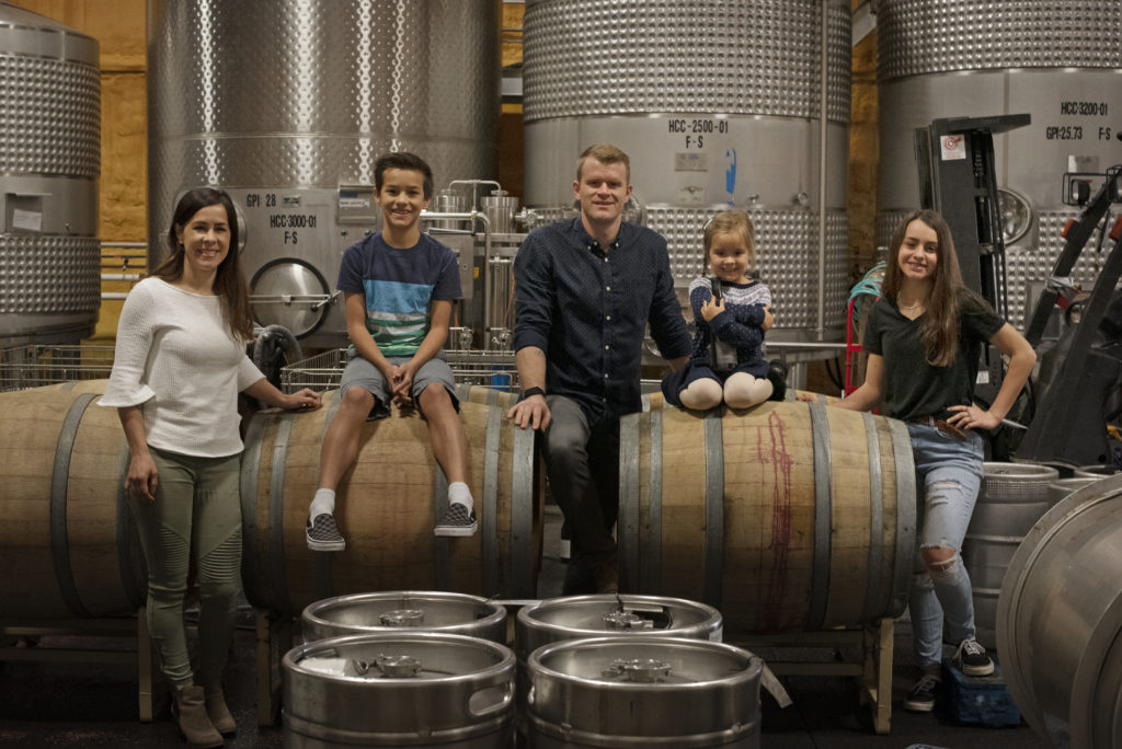 Alexis and Matt Iaconis with their three children, from left, Lincoln Rueter, 13, Olivia Iaconis, 4, and Hadley Rueter, 14, at Healdsburg Custom Crush where they produce brick & mortar wines in Healdsburg, California on April 4, 2020. (Photo: Erik Castro/for Sonoma Magazine)