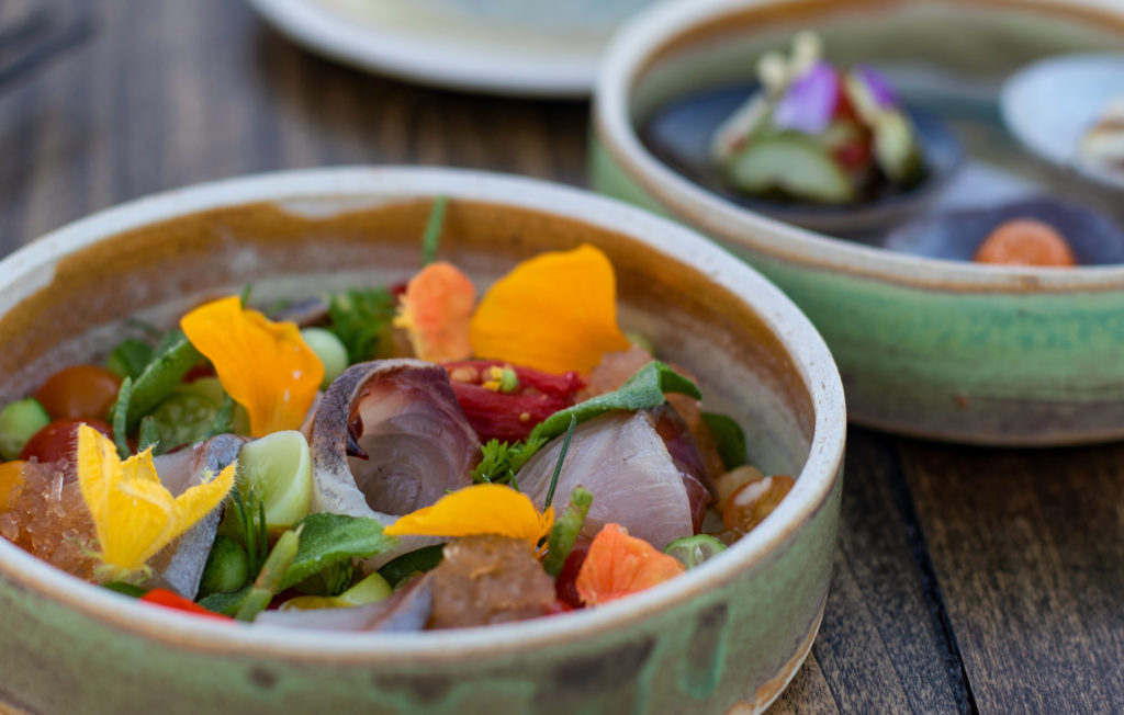 Wild Kagoshima Kanpachi with first of the season tomatoes, cucumber and pickled wasabi at Single Thread at Kistler Vineyards' Trenton Roadhouse. Heather Irwin/PD