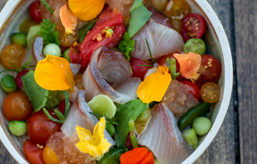 Wild Kagoshima Kanpachi with first of the season tomatoes, cucumber and pickled wasabi at Single Thread at Kistler Vineyards' Trenton Roadhouse. (Heather Irwin/Sonoma Magazine)