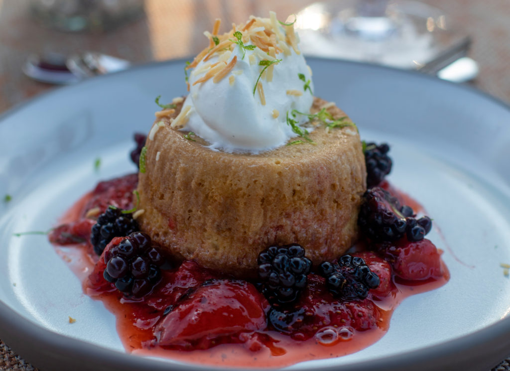 Coconut tres leches cake with roasted strawberries, blackberries, chantilly cream and lime zest. Heather Irwin/PD