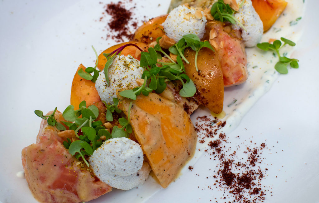 Tomato and stone fruit salad with bee pollen and microgreens at at Blue Ridge Kitchen in Sebastopol. Heather Irwin/PD