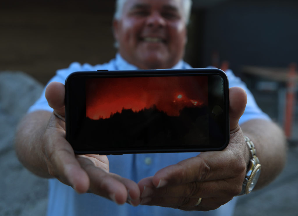 The orange blob pin the right hand side of Ed Nessinger phone is his guest house burning in Shiloh Ridge during last years Kincade fire. Messenger is building a fire resistant home for a client in the exclusive Shiloh Ridge subdivision in Windsor, May 27, 2020. (Kent Porter / The Press Democrat) 