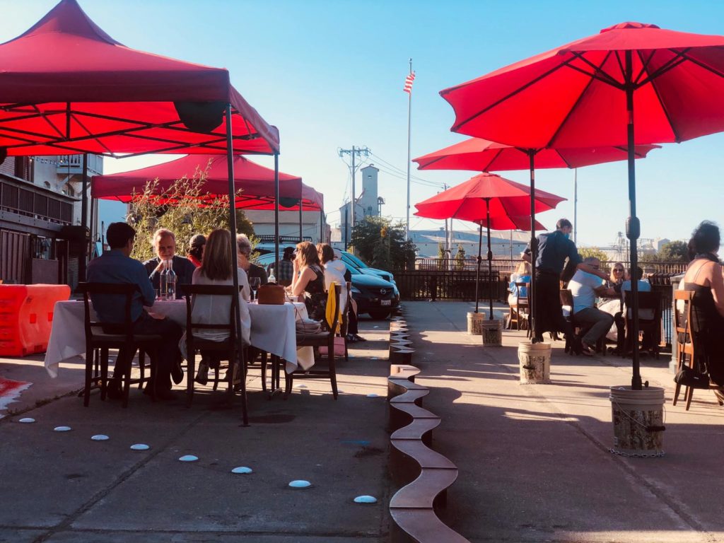 Outdoor dining along the river at Risibisi in Petaluma. Courtesy photo.