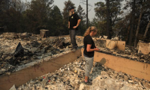 Adam and Liz Adams get the first look at their home burned by the Glass fire on Holst Road, Tuesday, Sept. 30, 2020 year Los Alamos Road. (Kent Porter / The Press Democrat)