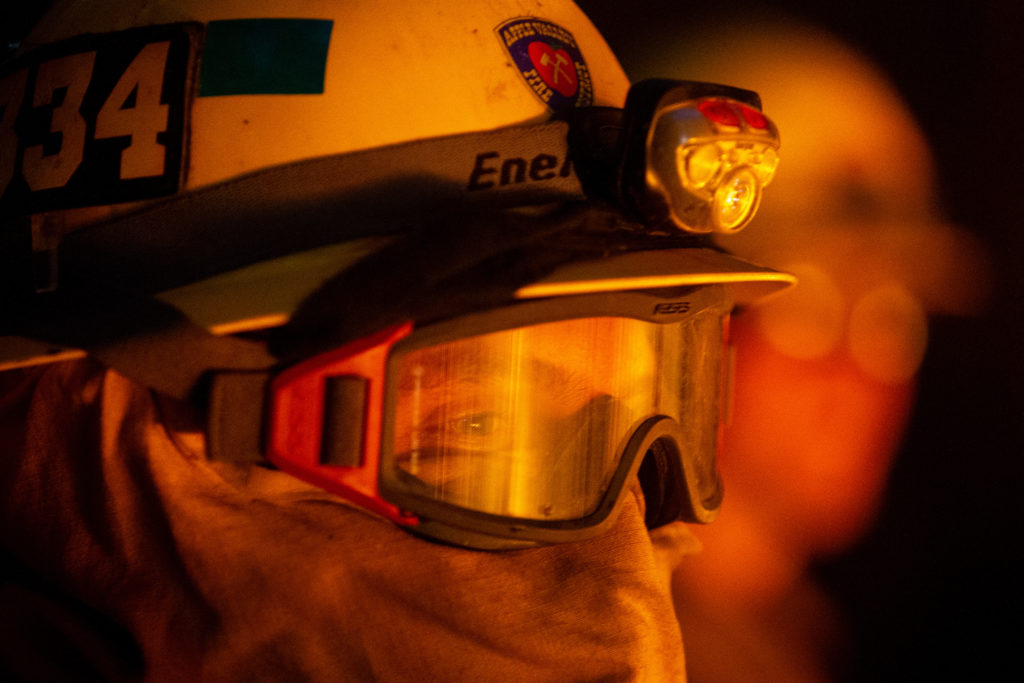 Apple Valley Fire District firefighter James Franco keeps an eye on the flames in front of him while his strike team reinforces a containment line during the Glass Fire at a rural property west of Gates Road near Santa Rosa, California, on Wednesday, September 30, 2020. (Alvin A.H. Jornada / The Press Democrat)