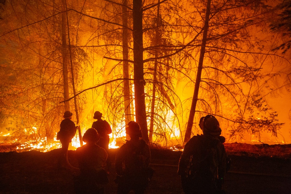 Firefighters from a strike team from southern California reinforce a containment line at a rural property west of Gates Road during the Glass Fire near Santa Rosa, California, on Wednesday, September 30, 2020. (Alvin A.H. Jornada / The Press Democrat)