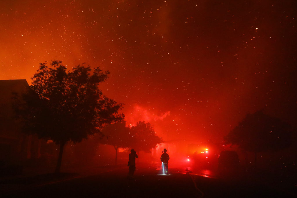 Embers fly from burning structures on Mountain Hawk Drive in Santa Rosa on Monday, September 28, 2020. (Christopher Chung/ The Press Democrat)