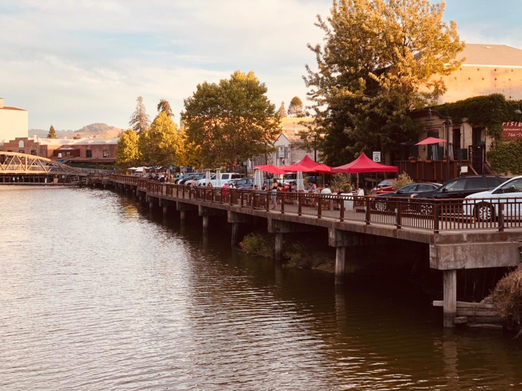 Outdoor dining along the river at Risibisi in Petaluma. Courtesy photo.
