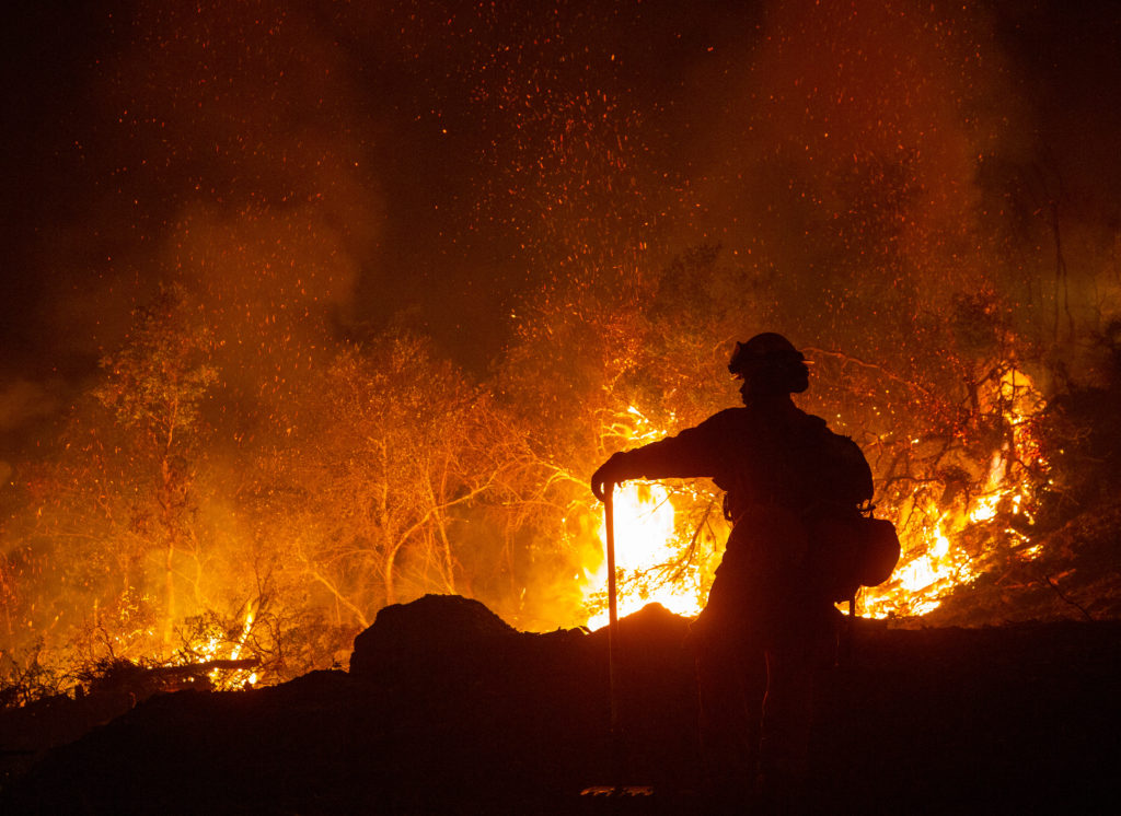 A Cal Fire inmate firefighter keeps watch during a defensive firing operation in the hills of Sugarloaf Ridge State Park during the Glass Fire in Kenwood, California, on Tuesday, September 29, 2020. (Alvin A.H. Jornada / The Press Democrat)