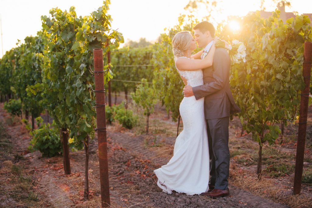 A couple takes a wedding photo outdoors at Vintners Inn. (Vintners Inn)