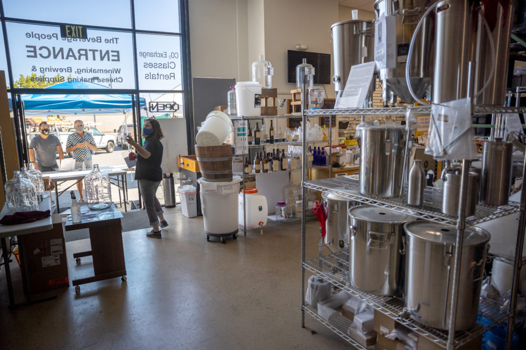Jane Jackson waiting on people at the front door at the Beverage People, the landmark store in Santa Rosa that helps SoCo home winemakers with the equipment and advice they need.